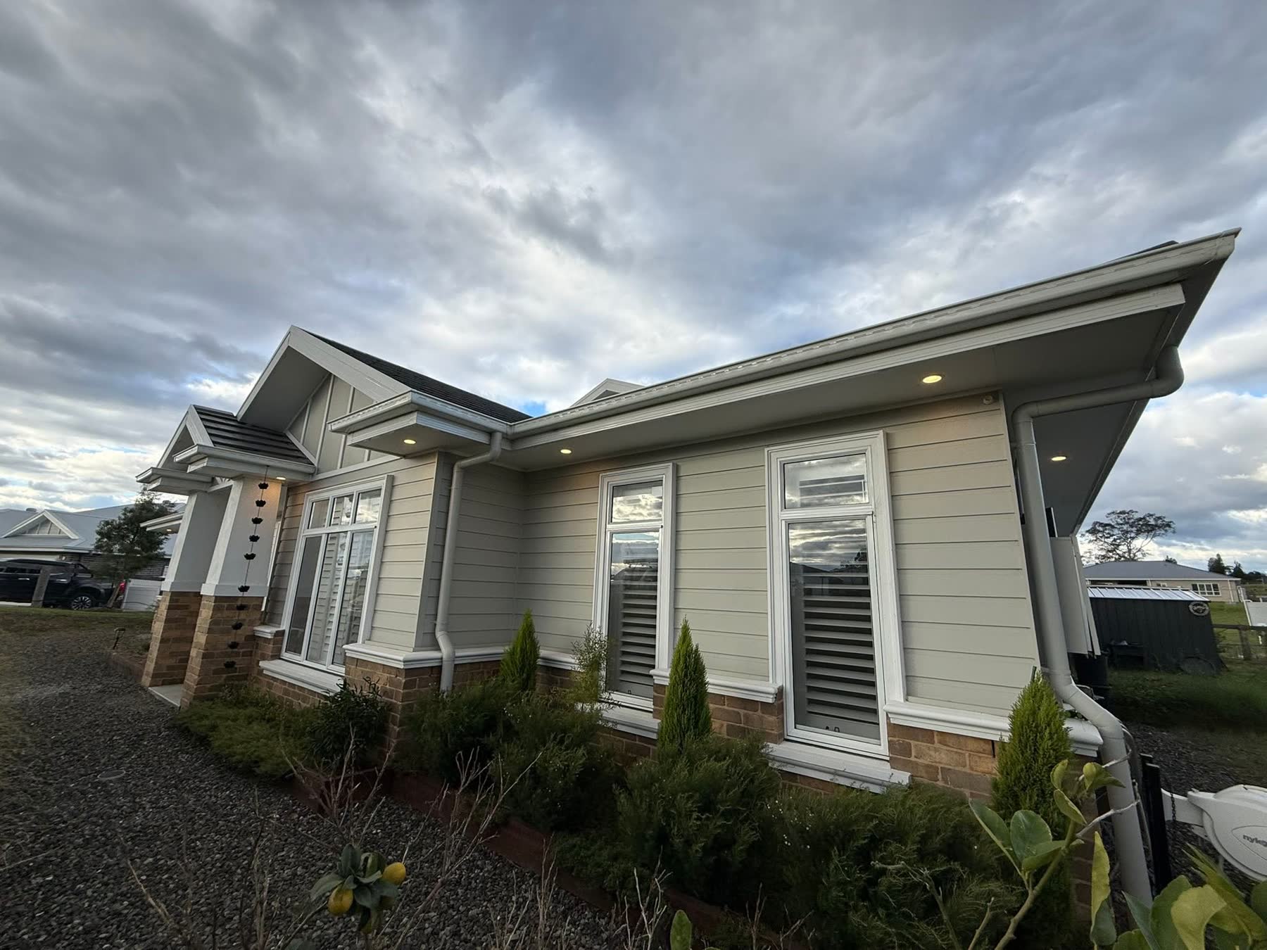 Modern Newcastle home exterior with recessed eave downlighting installed by NeoGen Electrical