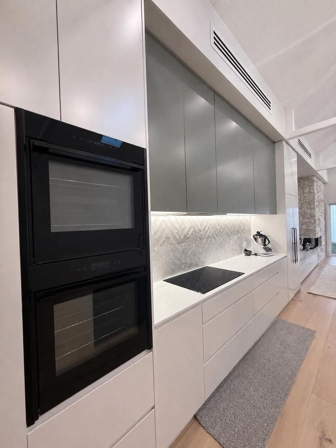 Integrated kitchen joinery with under-cabinet lighting and appliance wiring by NeoGen Electrical