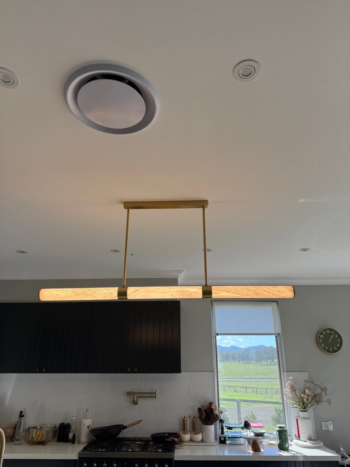 Kitchen ceiling downlights and brass pendant light installed by NeoGen Electrical
